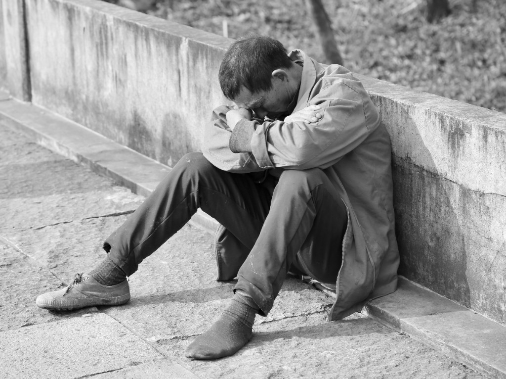 A man sitting alone in despair — the spiritual need of the mission field